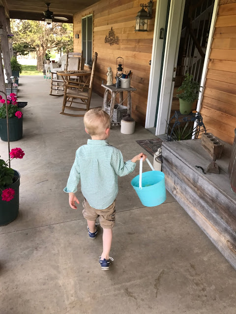 Boy walking on front porch 