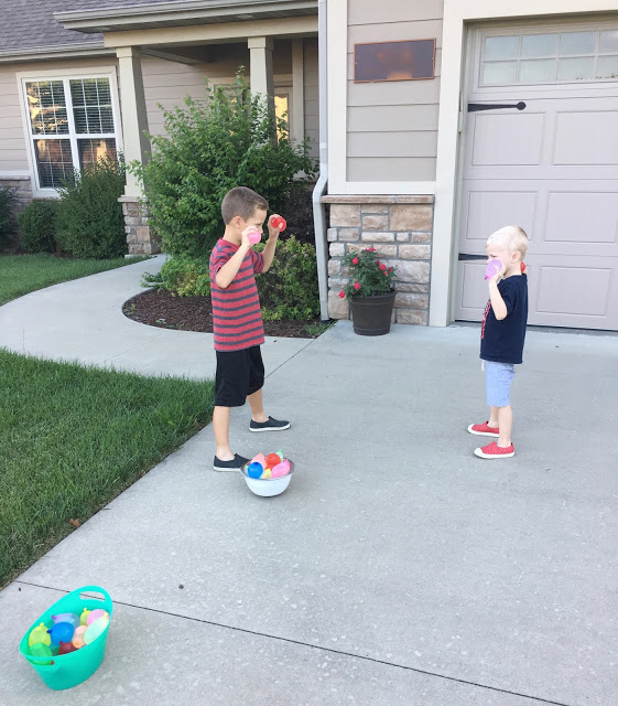 Young brothers water balloon fight 