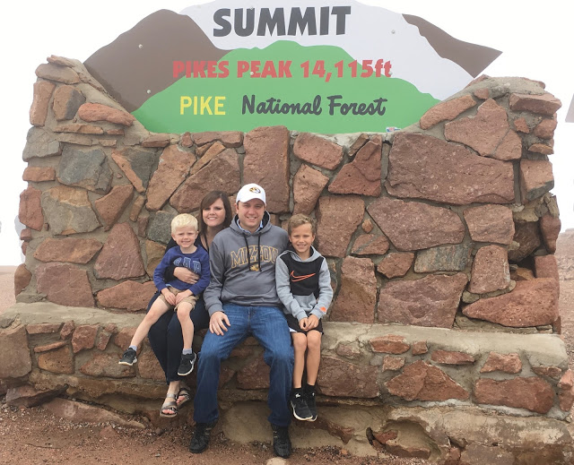 Family at summit Pike's Peak 