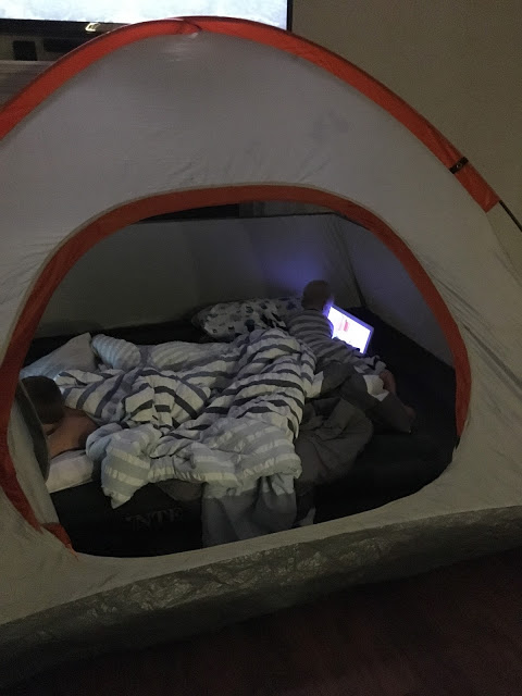 Boys camping indoors 
