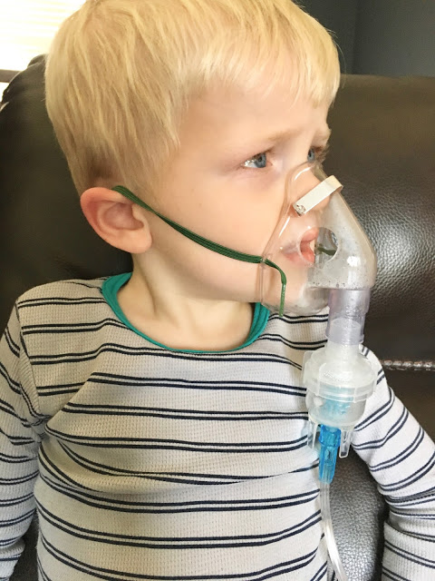 Little boy with nebulizer 