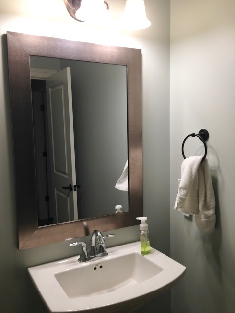 Gun metal silver mirror guest bathroom
