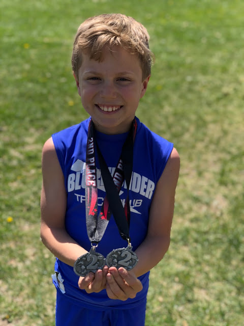 Weekend Update  boy with 2nd place medals for track 