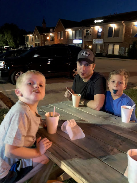 Weekend Recap Father and sons eating snow cones 