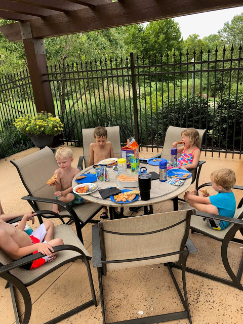 Labor Day Kids eating Pizza by the Pool 