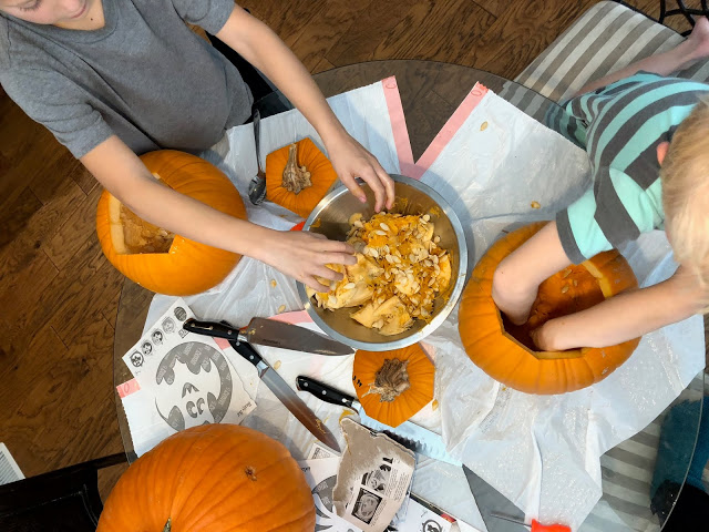 Family carving pumpkins 