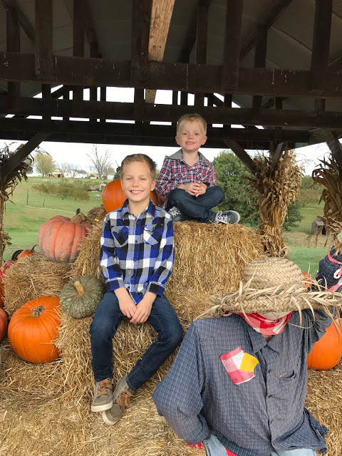 Boys with a scarecrow at the Pumpkin patch 