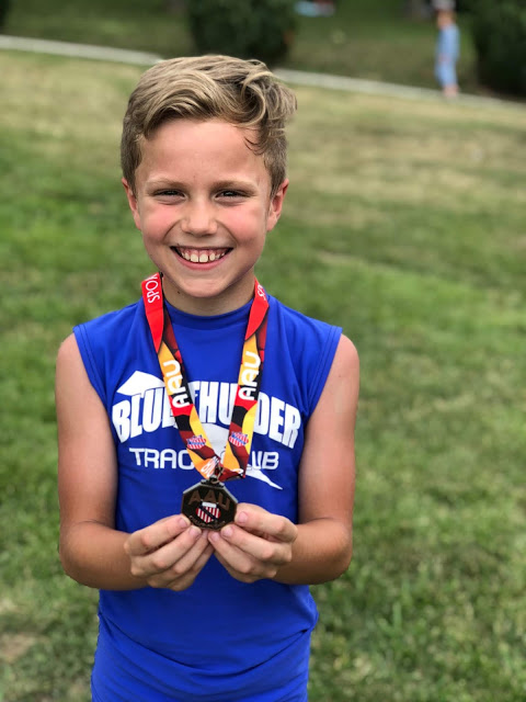 9 year old boy Track medal at districts 