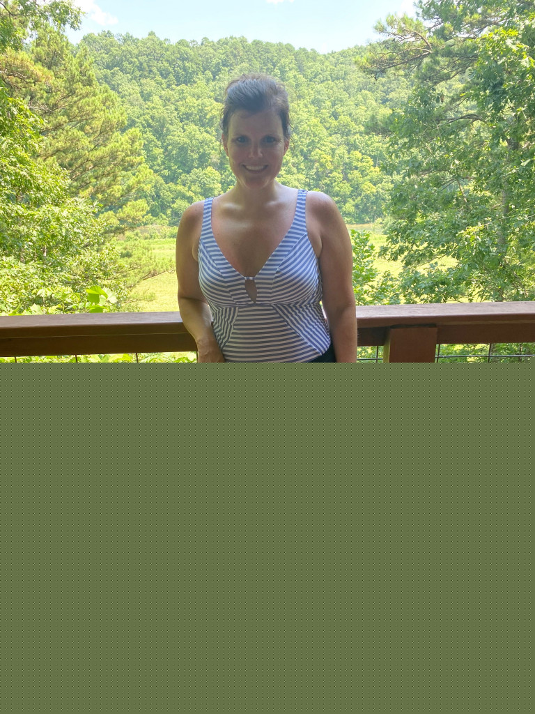 Woman in stripped swimsuit on porch