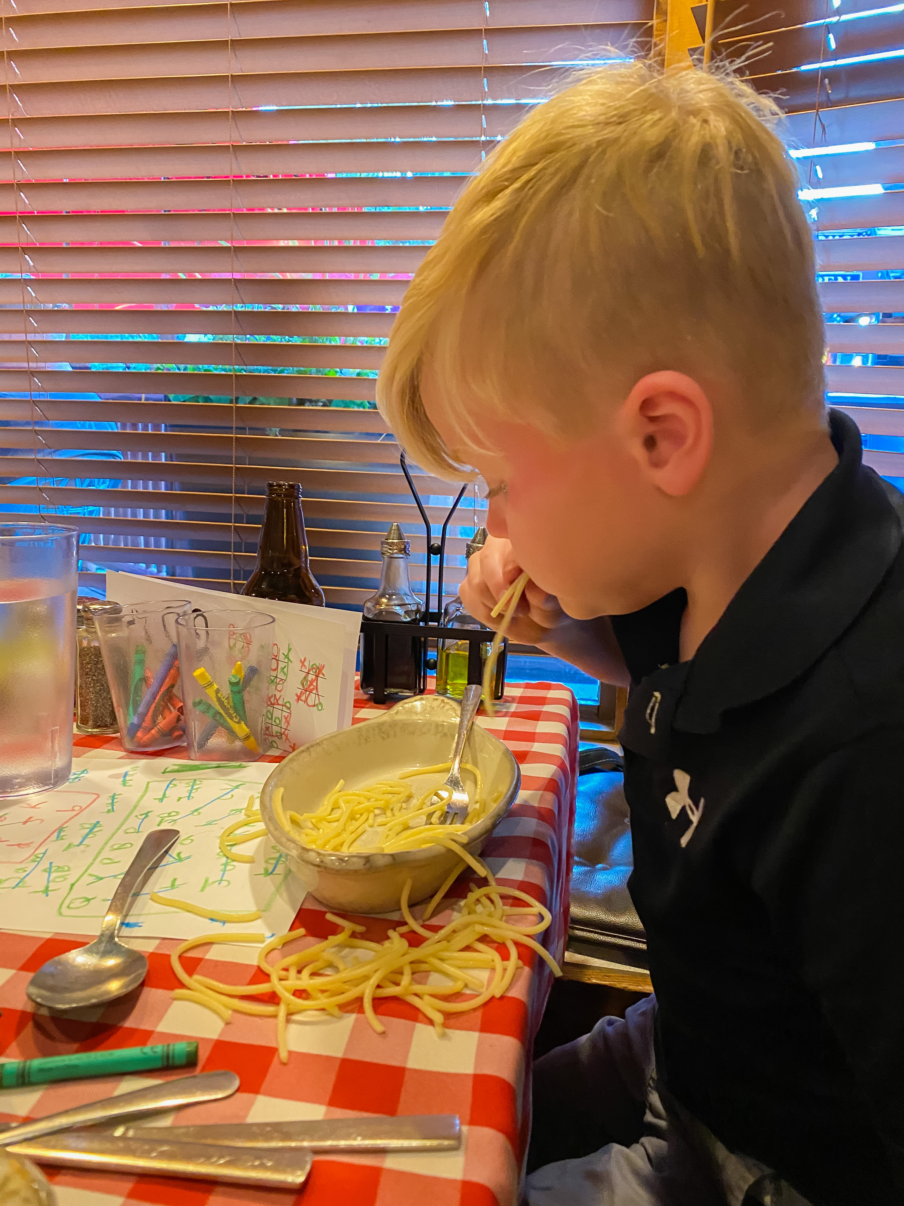 Boy eating pasta Michael's Italian Breckenridge